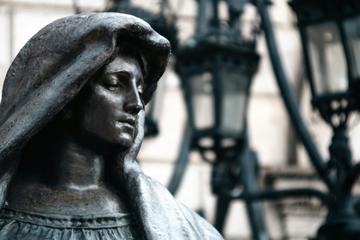 statue of a woman in a hood